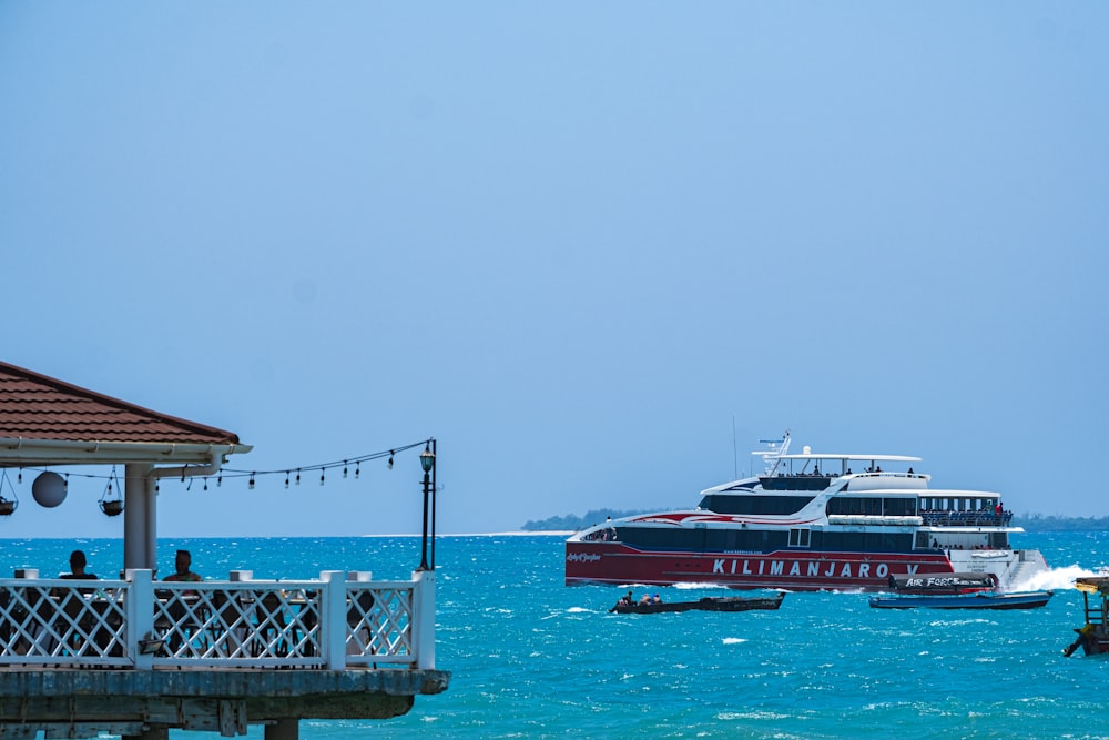 a boat in the water near a pier