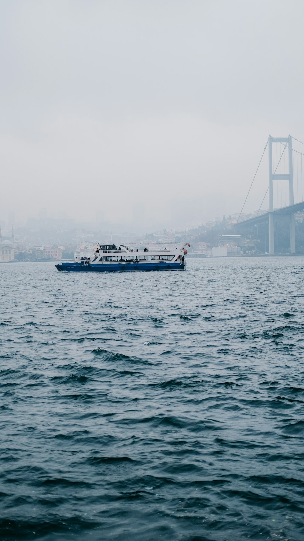 a large boat floating on top of a large body of water