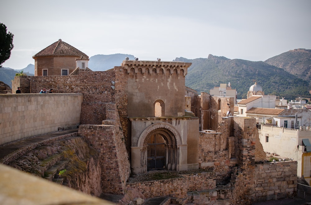 a view of a city with mountains in the background