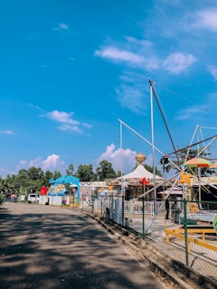 Colorful rides and families having fun at Anand Amusement Park, formerly Troika Park.