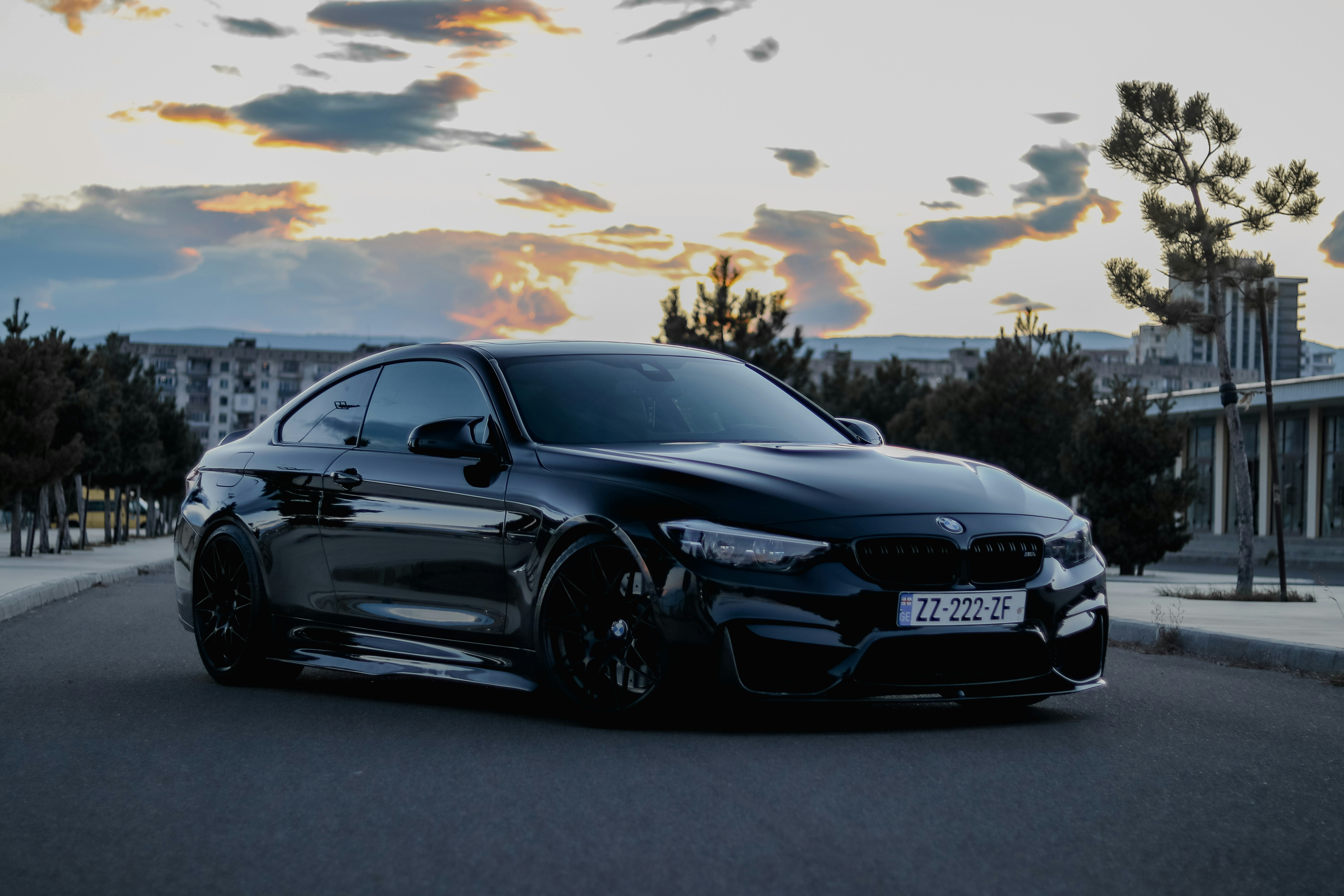 Modern passenger car on dark road, cinematic night photography, dramatic lighting