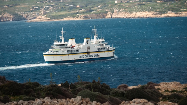 a large white and yellow boat on a body of water