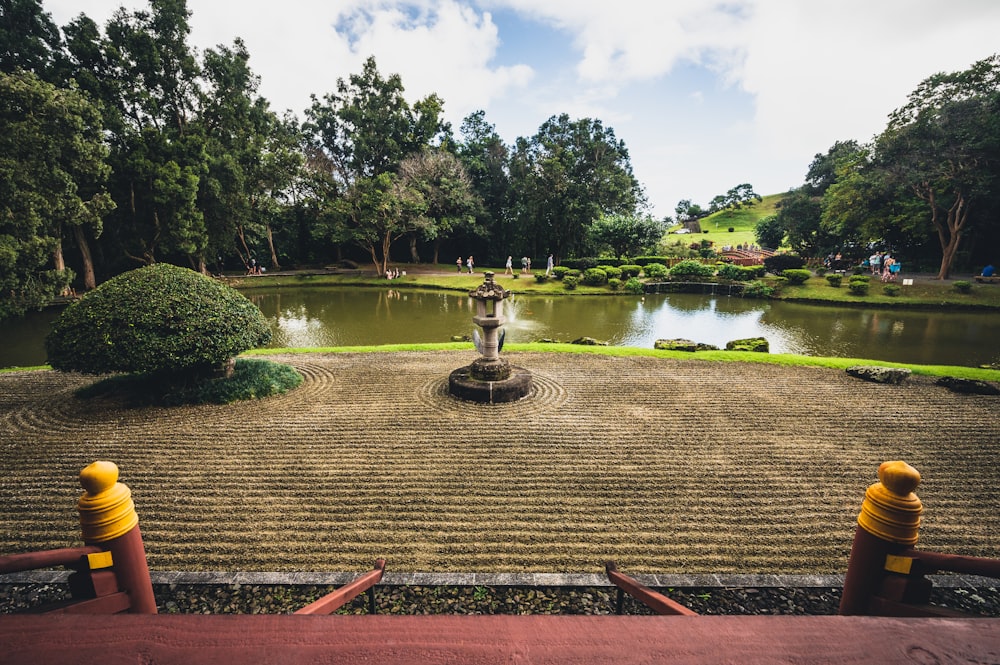 a view of a garden with a fountain in the middle of it
