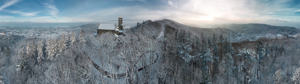 a snowy mountain with a church on top of it