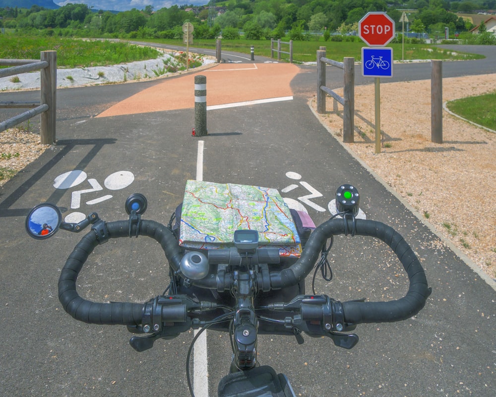 a bicycle with a map on the handlebars