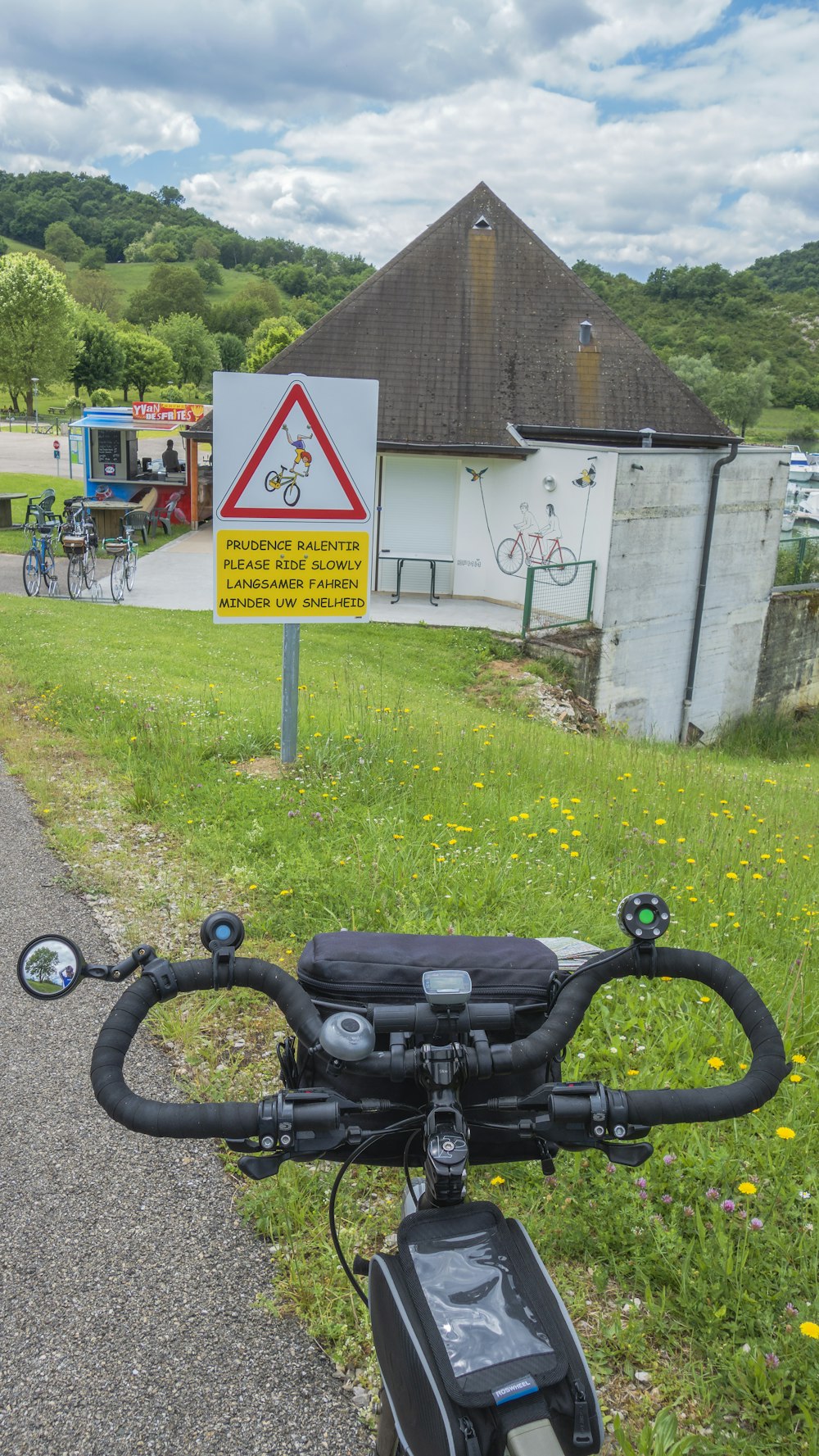 a bicycle parked on the side of a road