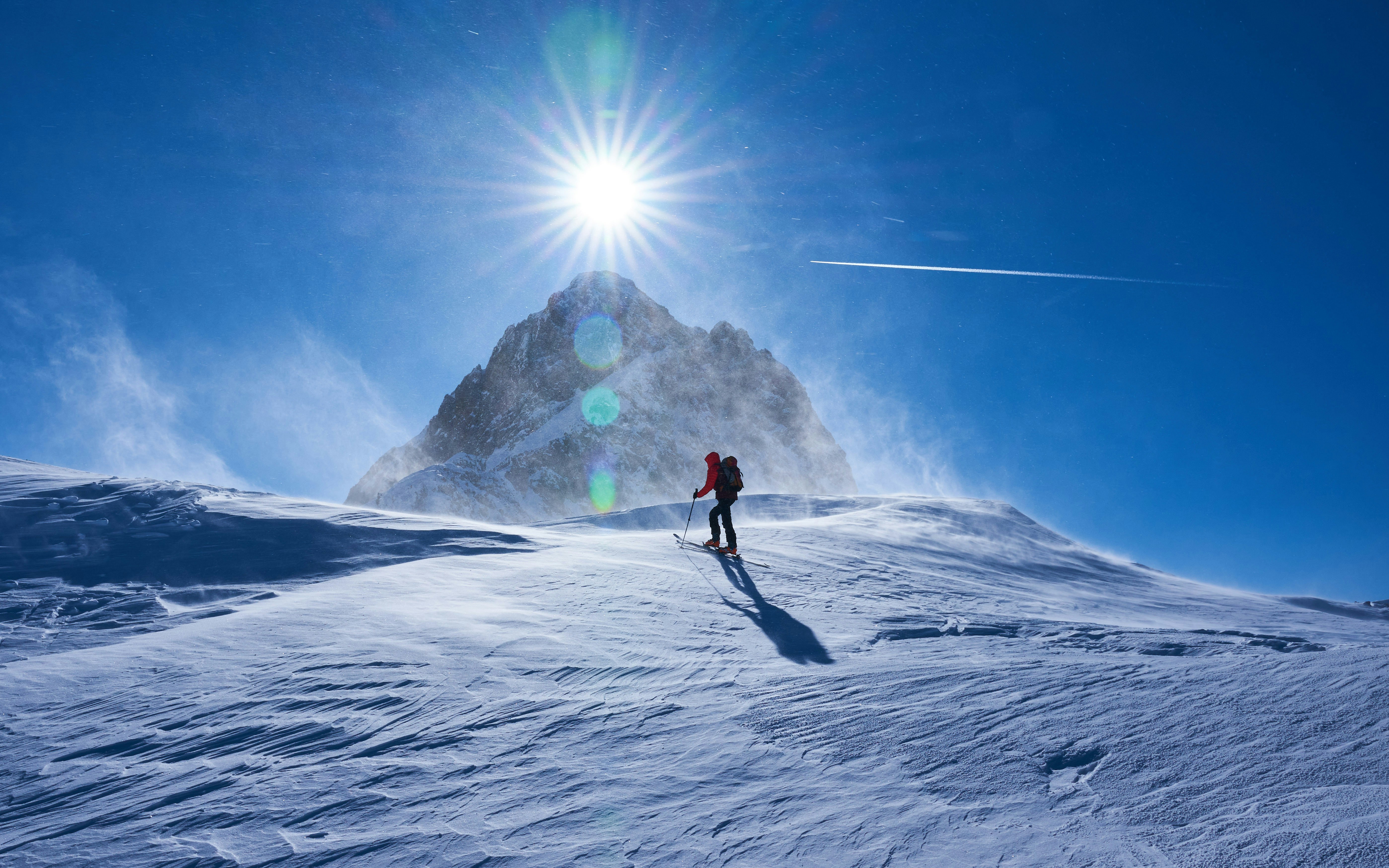 a person skiing down a snow covered mountain