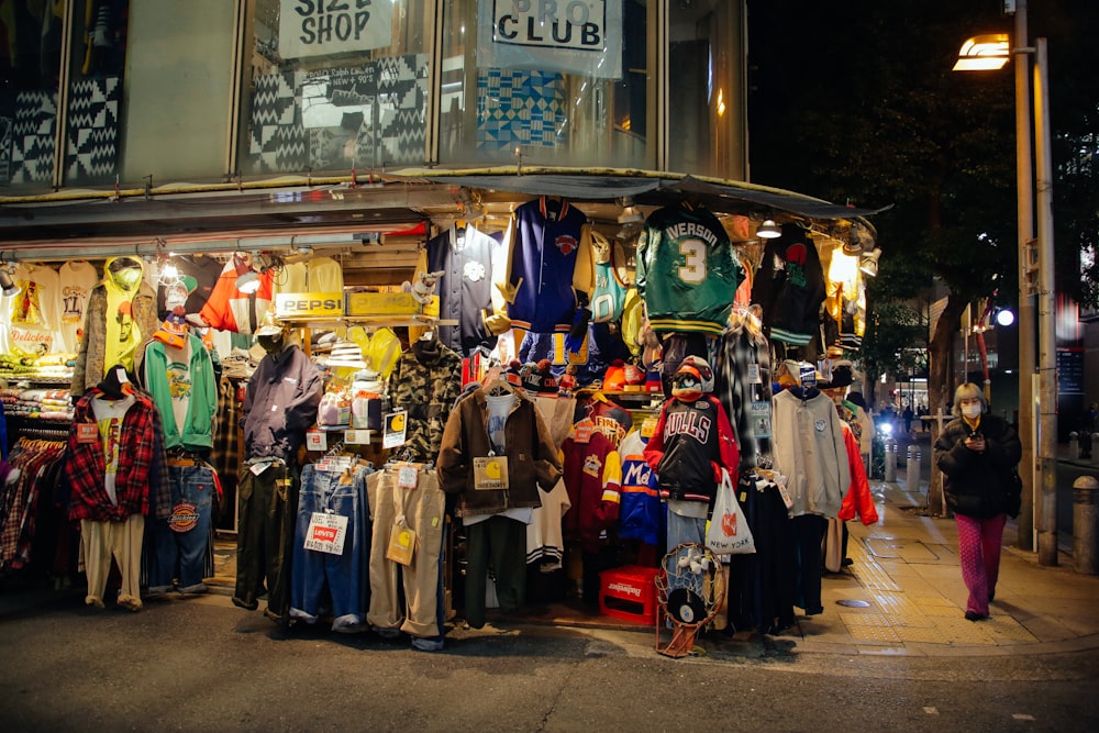 a group of people standing in front of a store