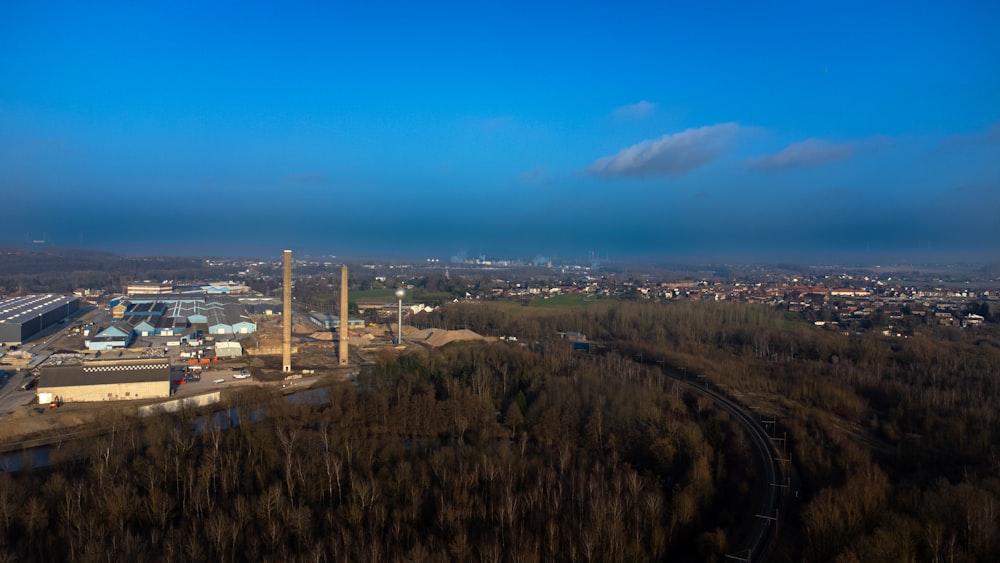 an aerial view of a factory in the distance