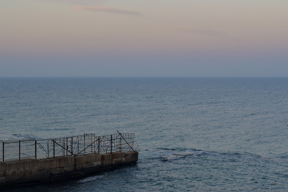 a large body of water sitting under a cloudy sky