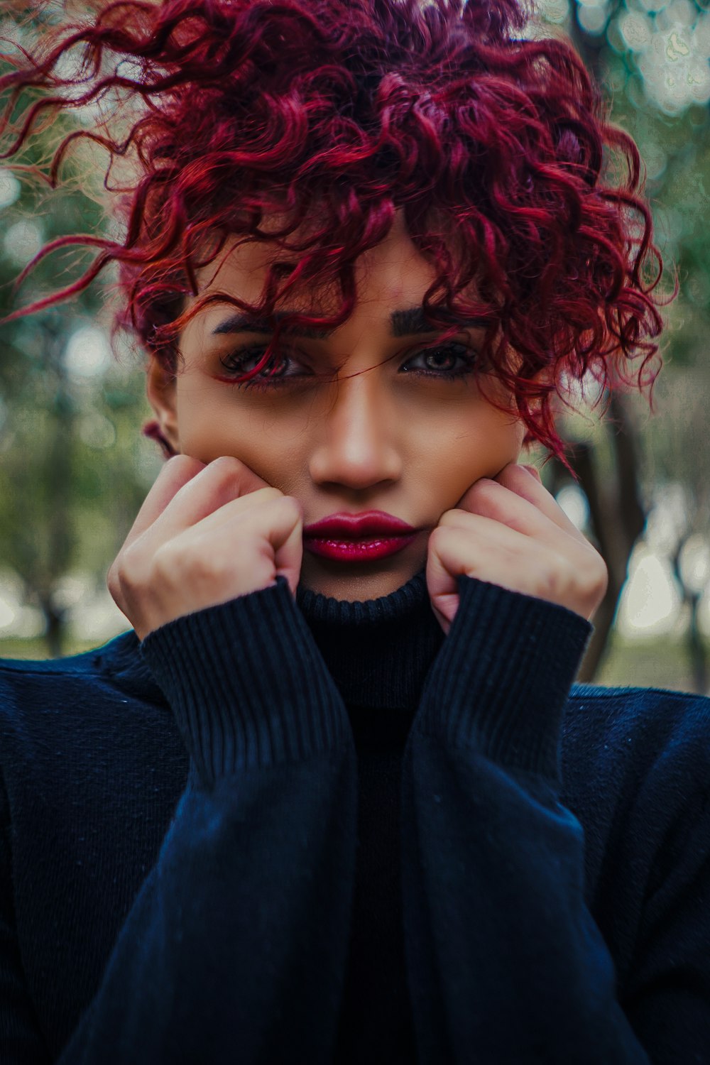 a close up of a person with red hair