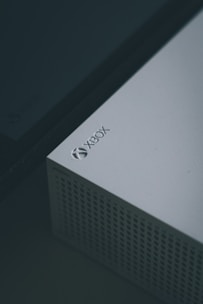 Close-up of a video game console with cooling fans being inspected.