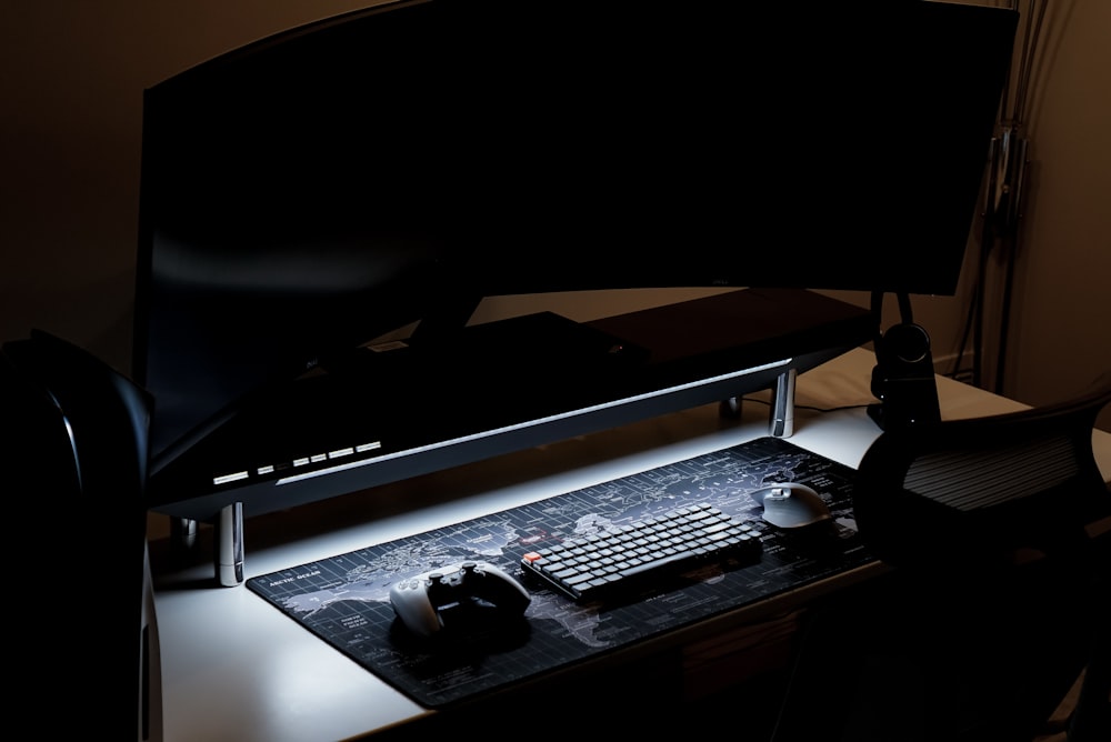 a computer desk with a keyboard and mouse