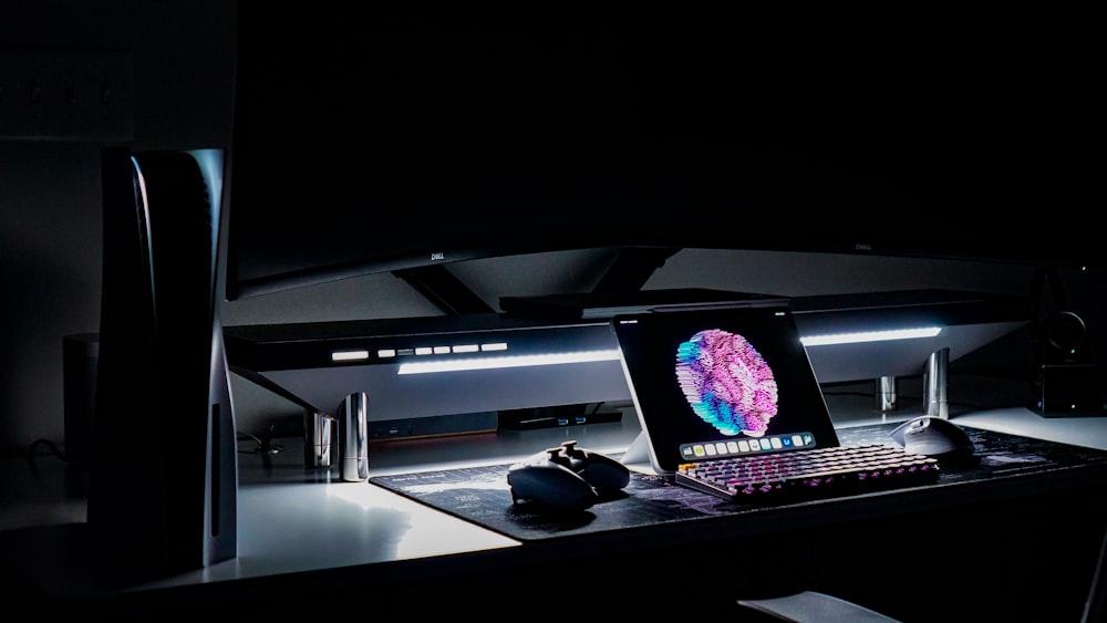 a laptop computer sitting on top of a desk