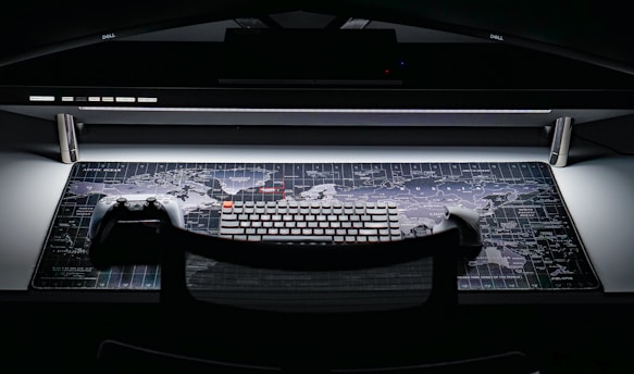 a computer keyboard sitting on top of a desk