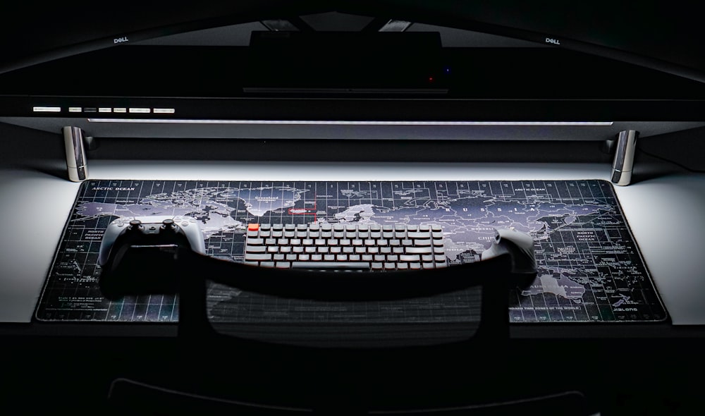 a computer keyboard sitting on top of a desk