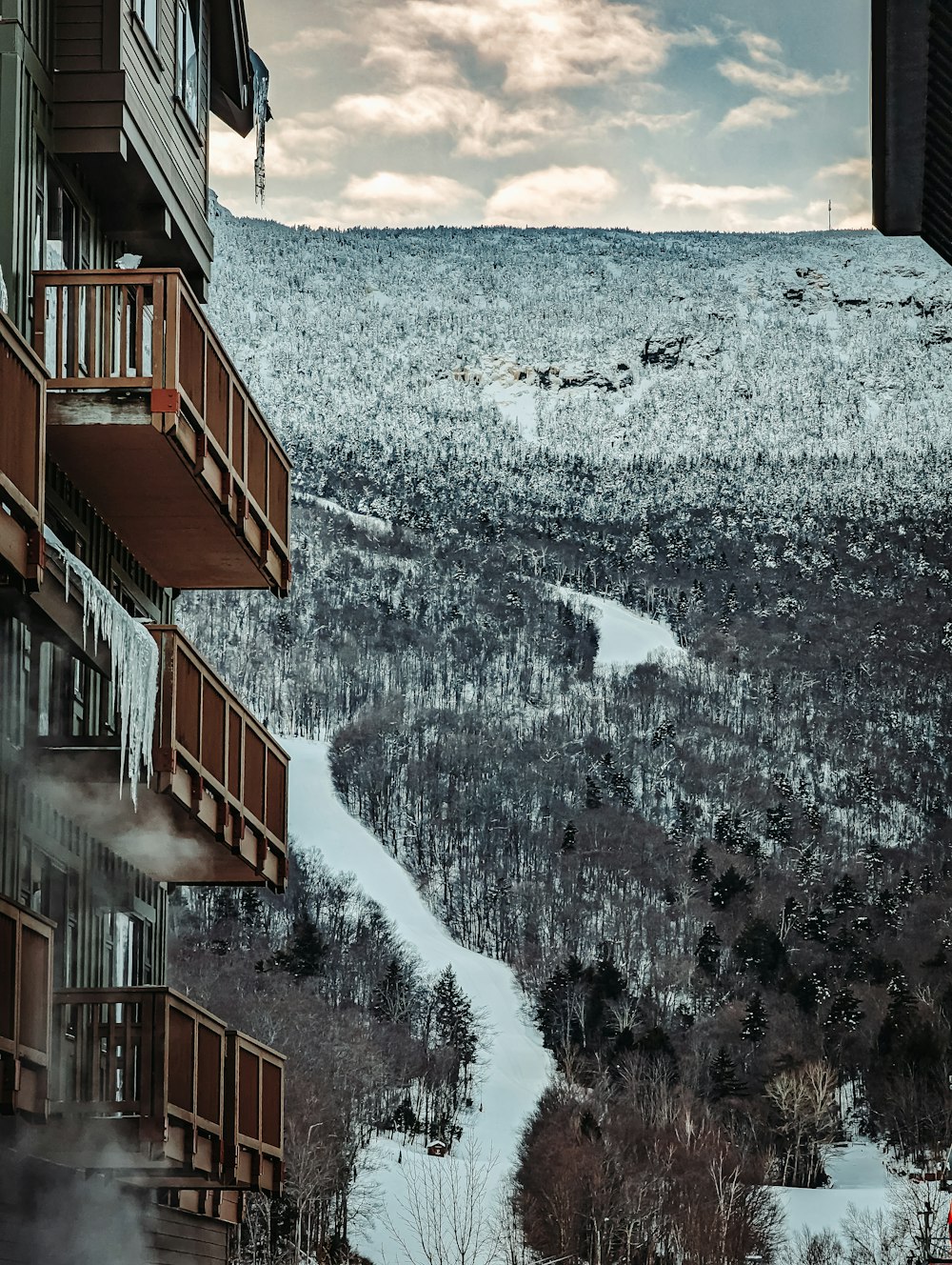a view of a snow covered mountain from a building