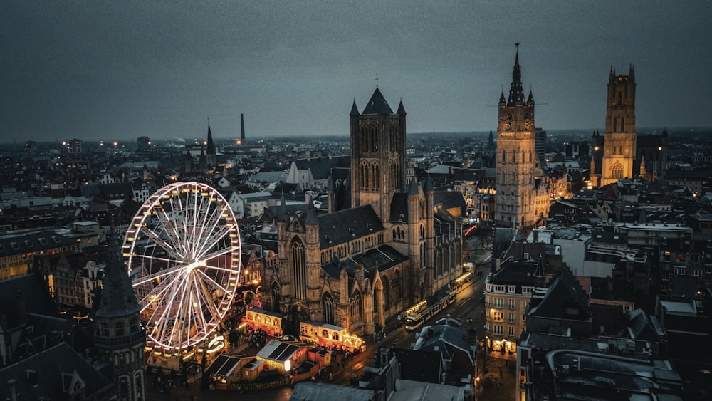 an aerial view of a city with a ferris wheel