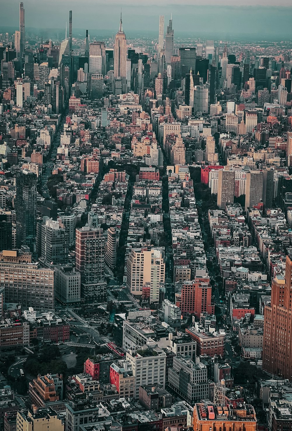 an aerial view of a city with lots of tall buildings