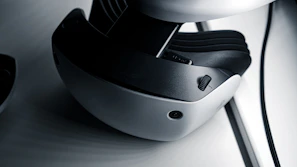 A close-up of a virtual reality headset reflecting a vibrant digital landscape.