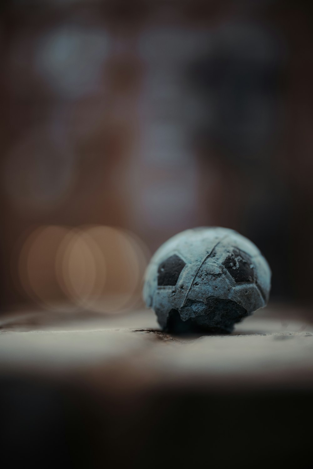 a blue ball sitting on top of a wooden table