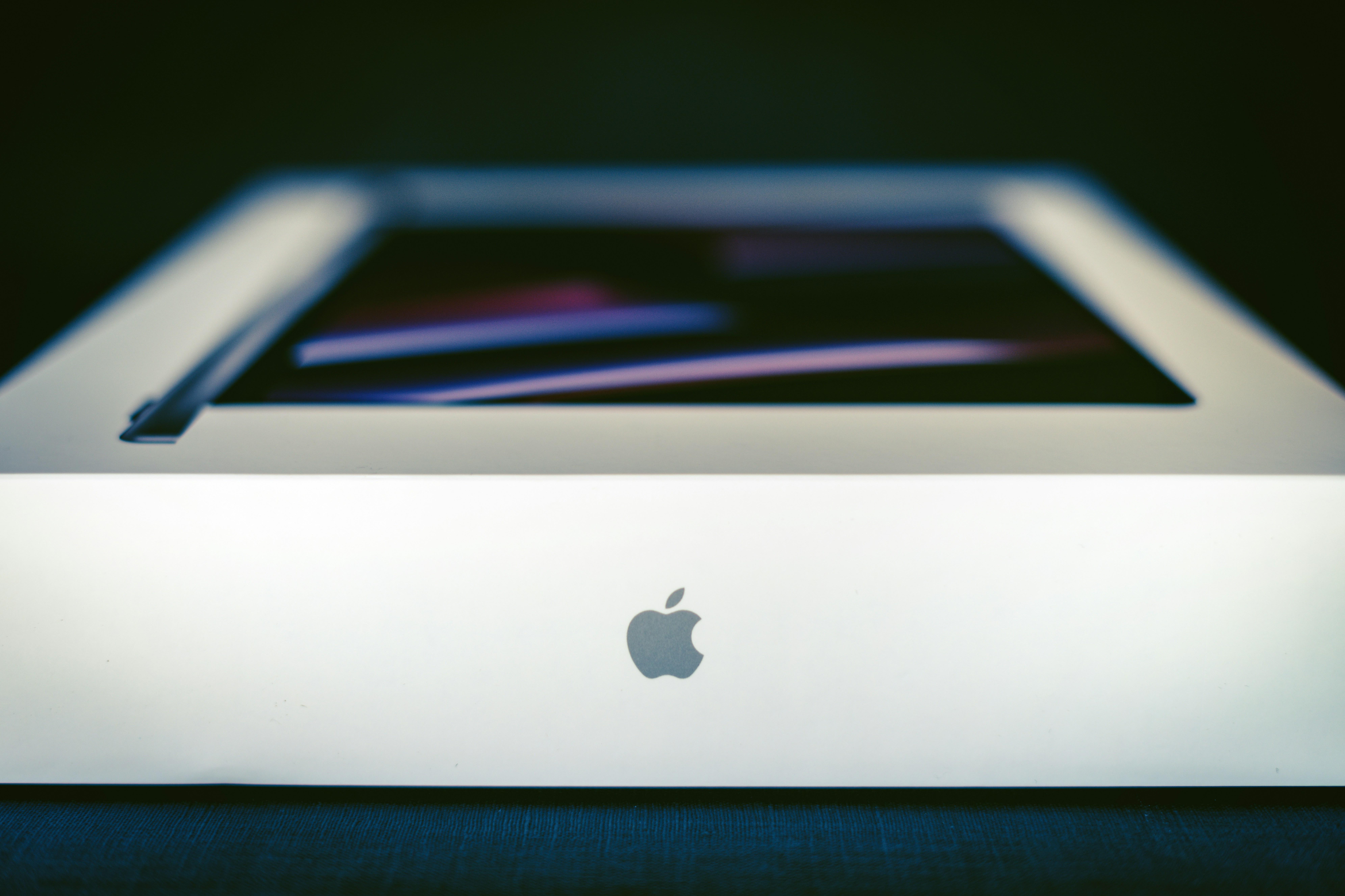 an apple computer sitting on top of a table