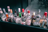 a bunch of liquor bottles sitting on top of a table
