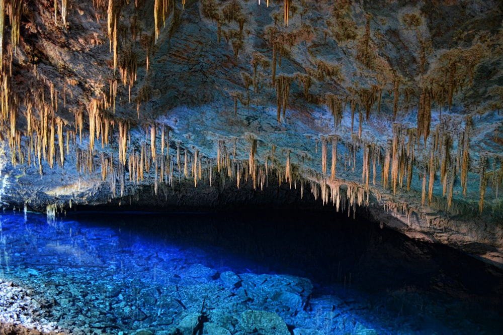 a cave filled with lots of blue water