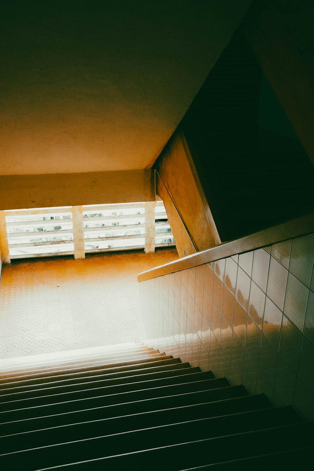 a stairway leading up to a window in a building