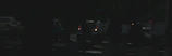 Emergency roadside assistance van parked beside a broken-down vehicle at dusk