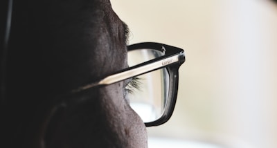 A close-up of a customer trying on glasses.