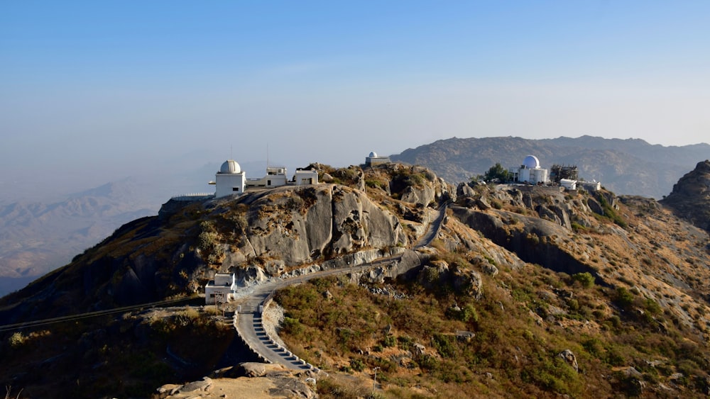 a mountain with a path leading to a building on top of it