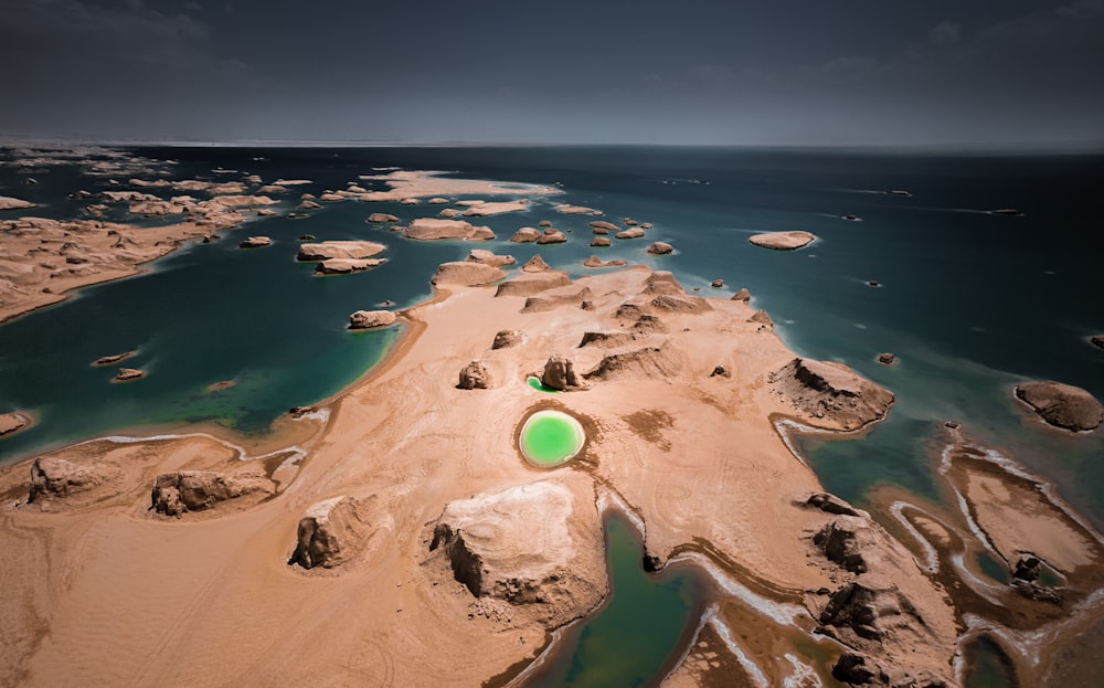 an aerial view of a beach with a green frisbee