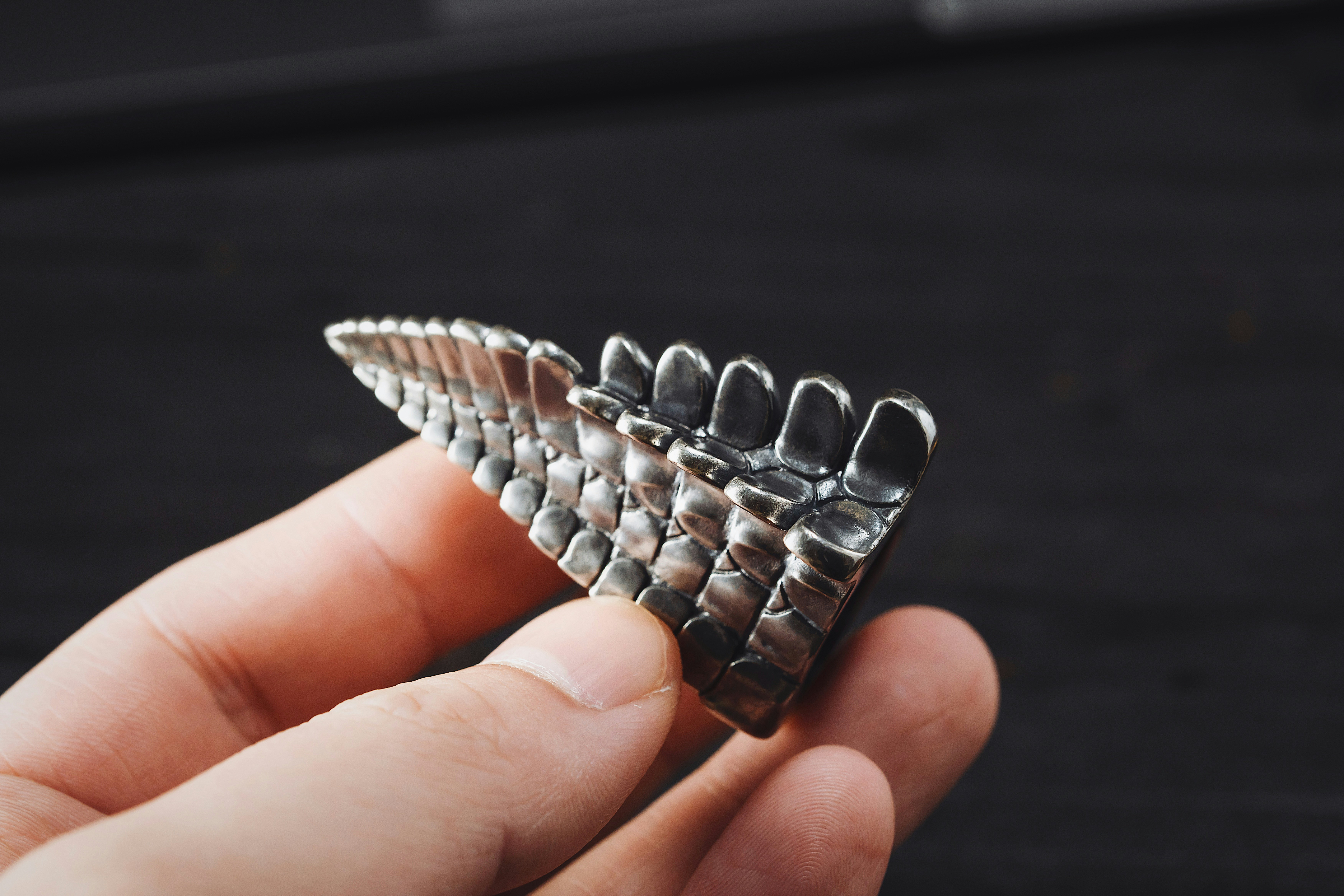 a person holding a metal object in their hand