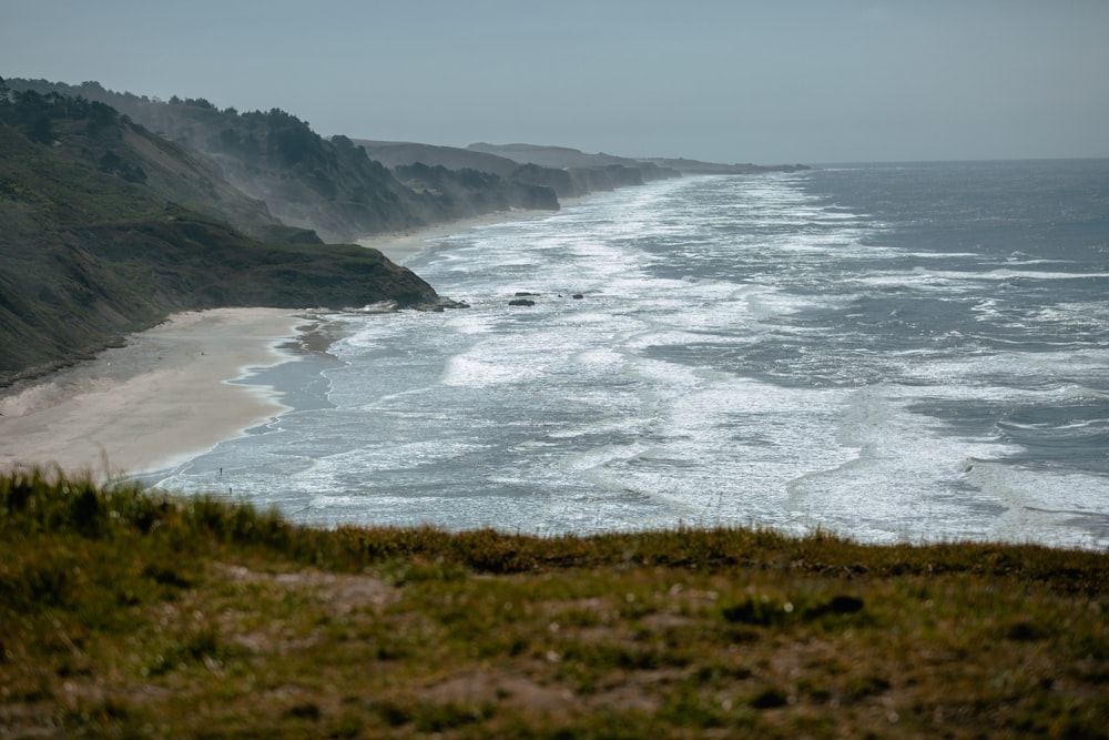 a view of the ocean from a hill