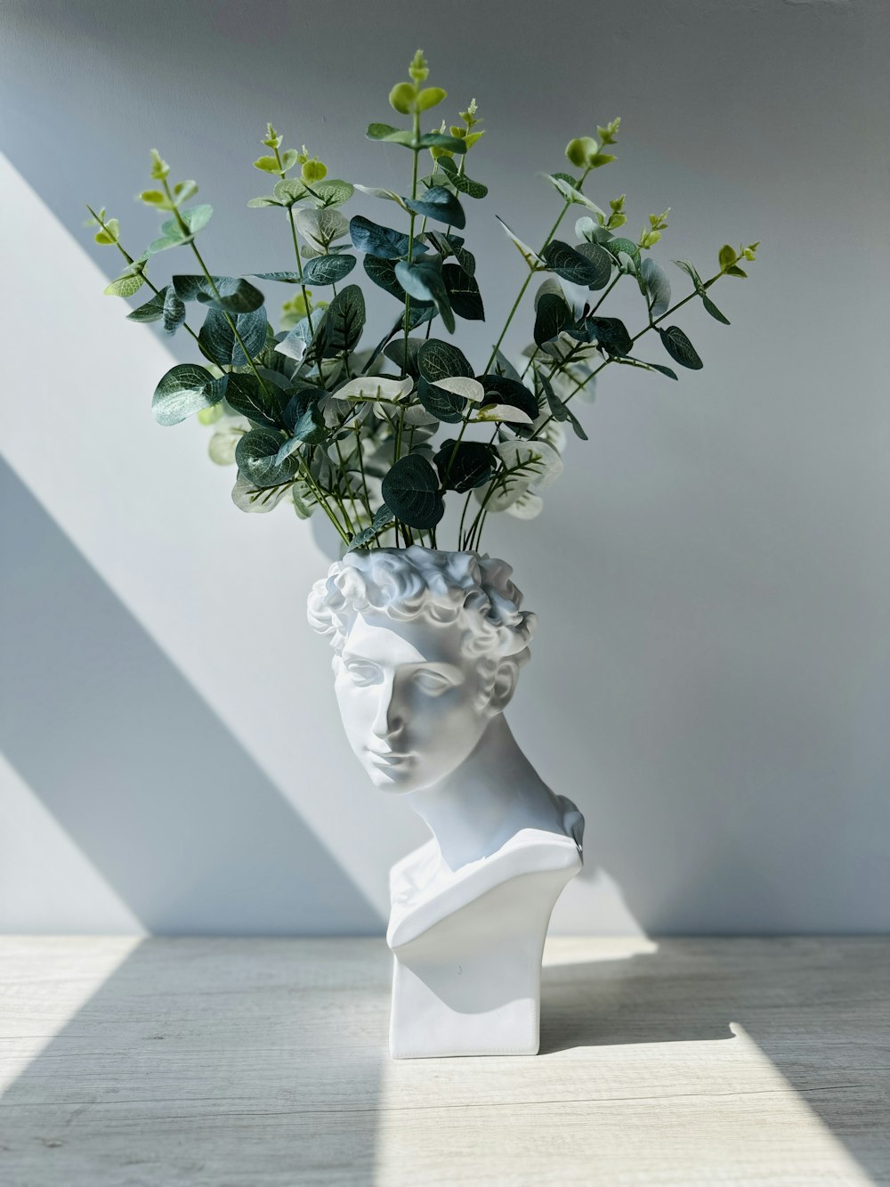 a vase with flowers in it sitting on a table