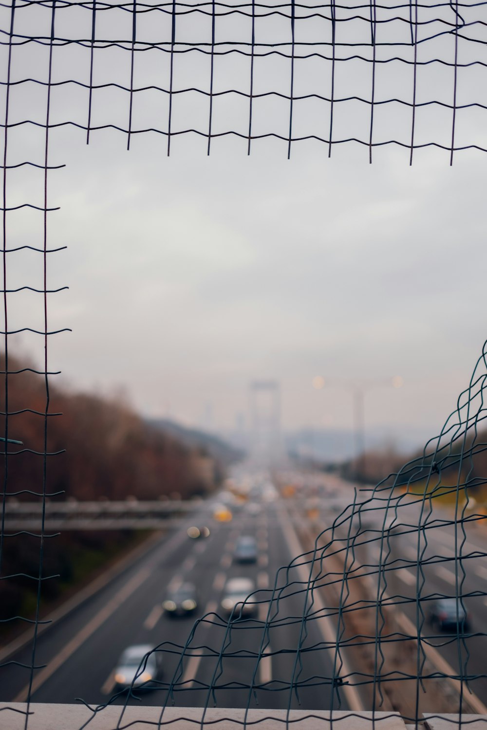 a blurry picture of a highway with cars on it