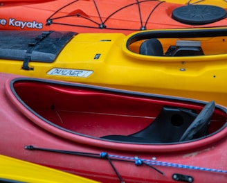 a row of kayaks lined up in a row