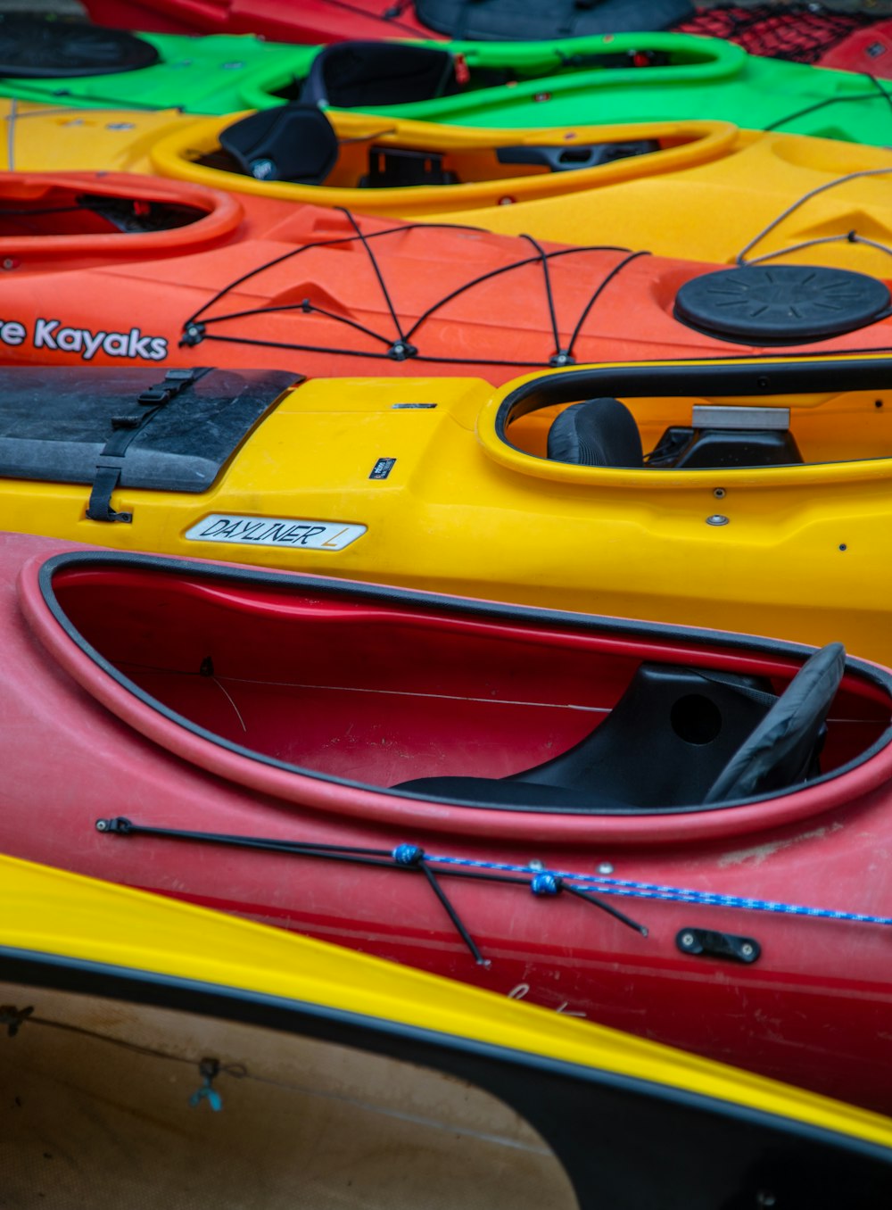 a row of kayaks lined up in a row