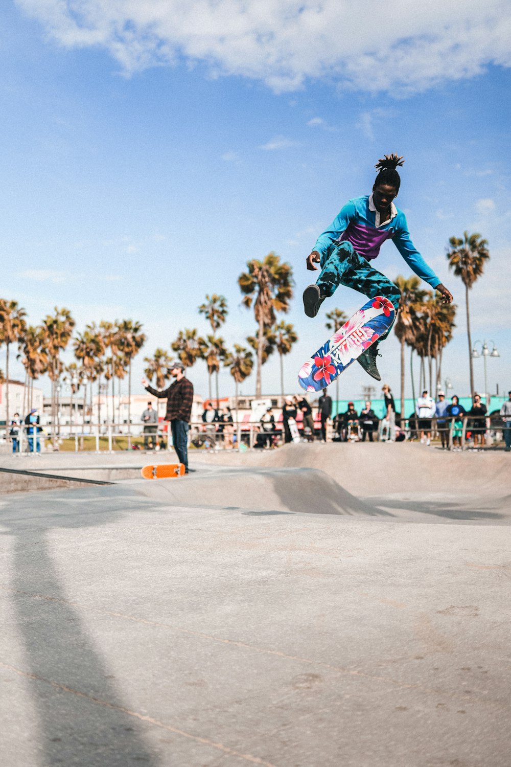 a man flying through the air while riding a skateboard