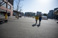 A scenic view of a city with people walking and interacting.