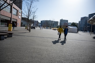 A scenic view of a city with people walking and interacting.