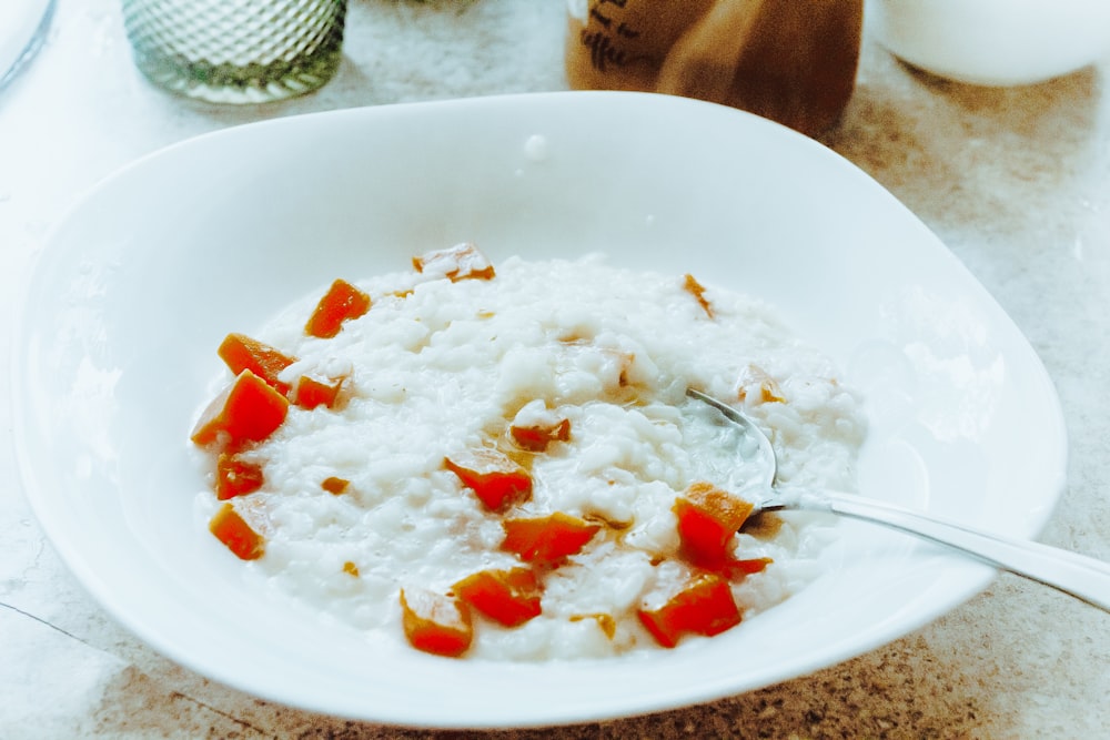 a bowl of rice with a spoon in it