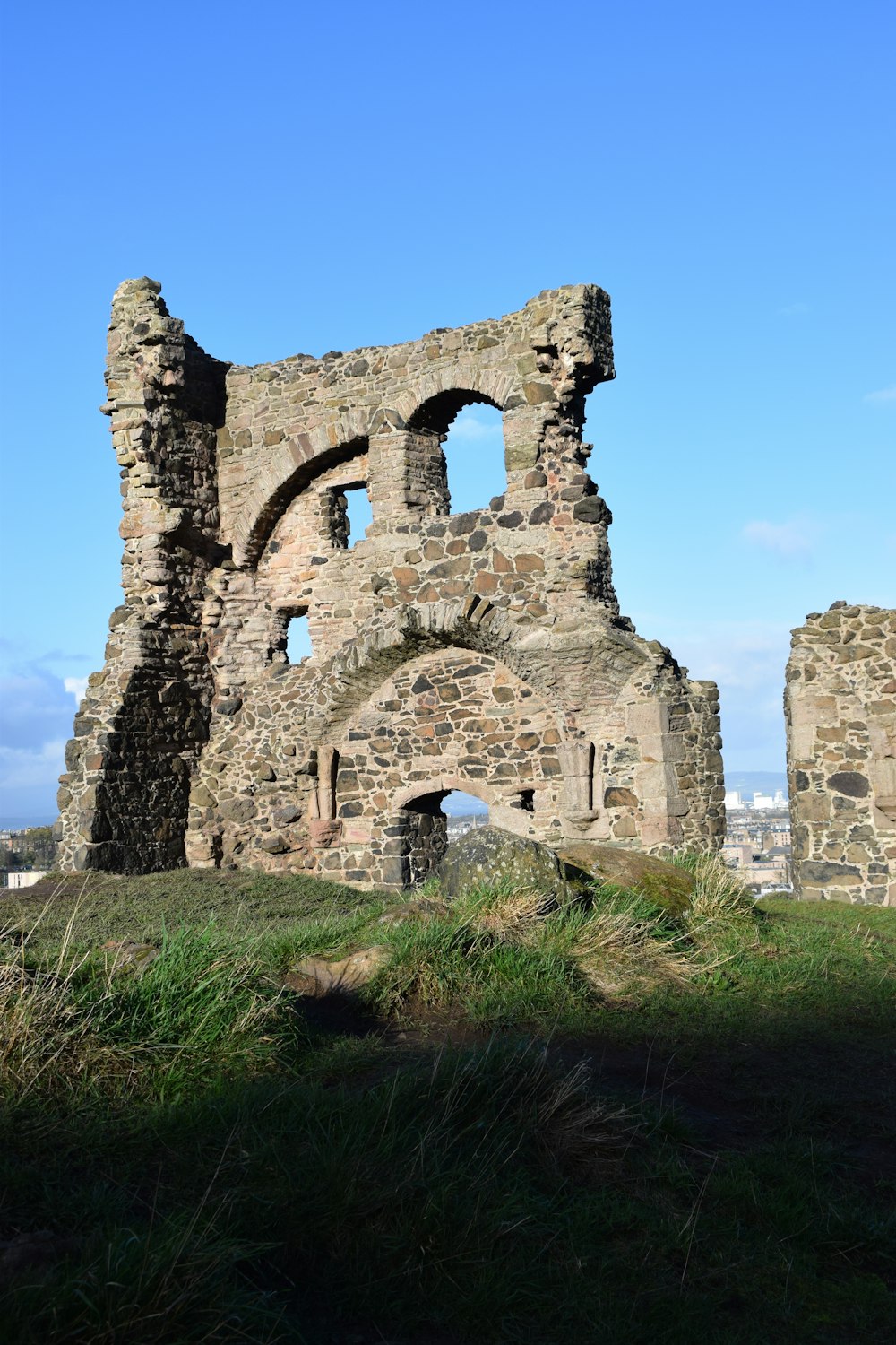 the ruins of an old castle on a hill