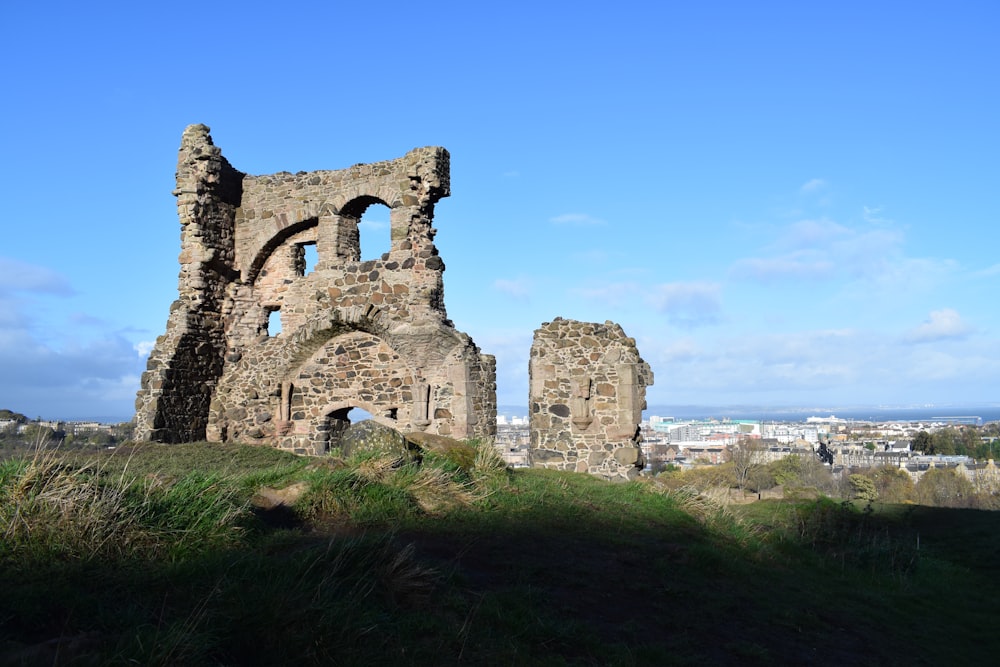 the ruins of an old building on a hill