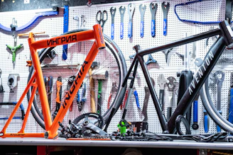 a bicycle is sitting on a table in a bike shop