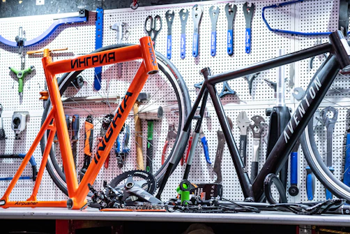 a bicycle is sitting on a table in a bike shop