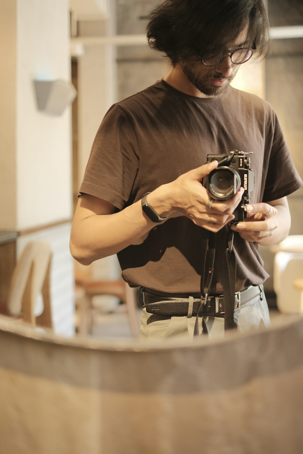 a man holding a camera in his hands