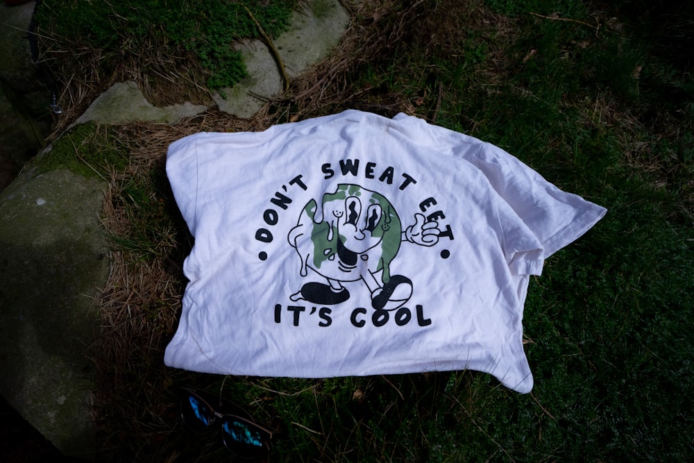 a white t - shirt that says don't sweat eat it's cool