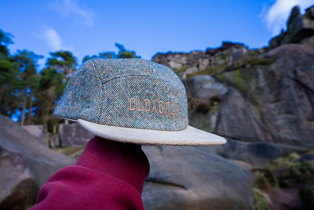 a person wearing a hat with writing on it